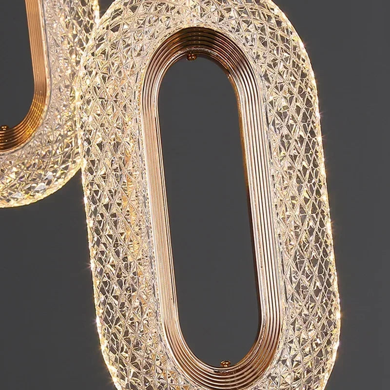 Suspension elliptique nordique en métal doré, lumière chaleureuse design 2025