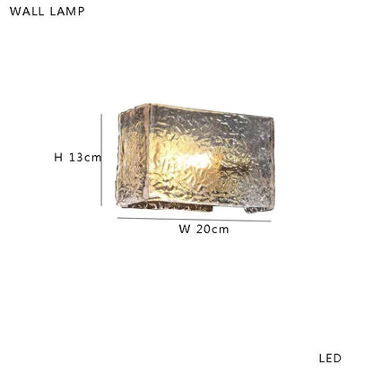 Lampadaire en laiton et verre transparent, lumière d'ambiance chaleureuse, design moderne - Luminous Place